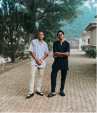 The two brothers standing outside