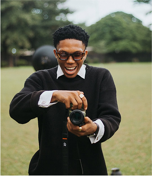Photographer smiling with camera